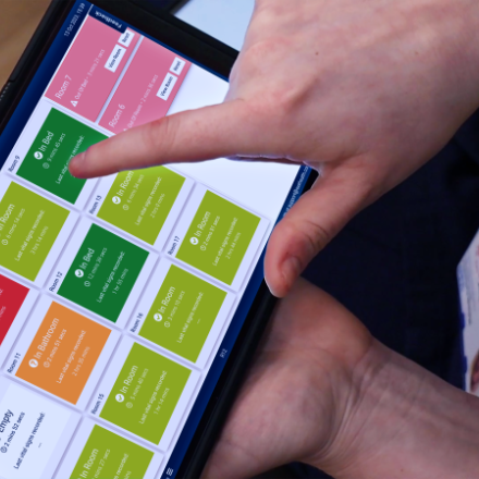 Image showing Oxehealth app on tablet screen and person's hand using it