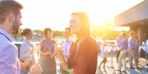 People talking at a summer event.